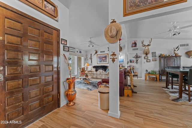 entrance foyer with ceiling fan, light wood-type flooring, lofted ceiling, and visible vents