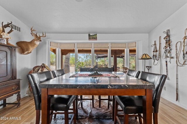 dining area with light hardwood / wood-style flooring