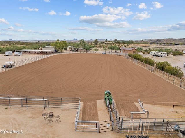 drone / aerial view with a mountain view and a rural view