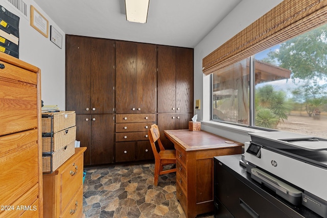 office space with stone finish flooring