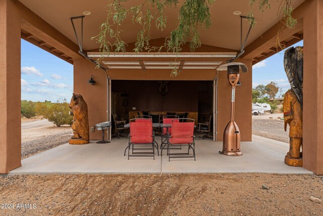 view of patio / terrace featuring a garage