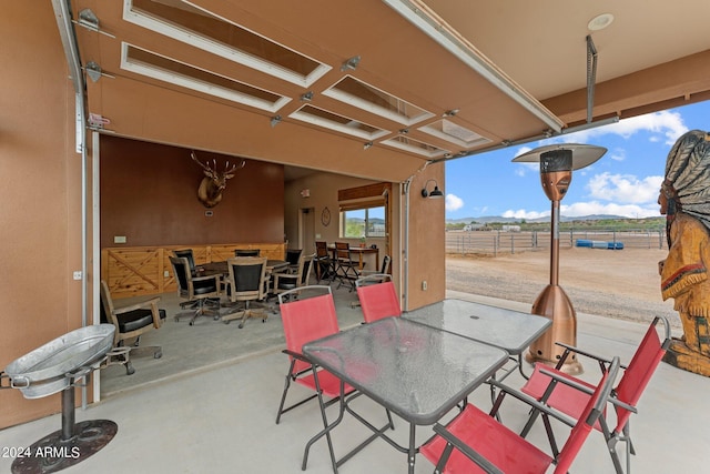 view of patio featuring fence and outdoor dining area