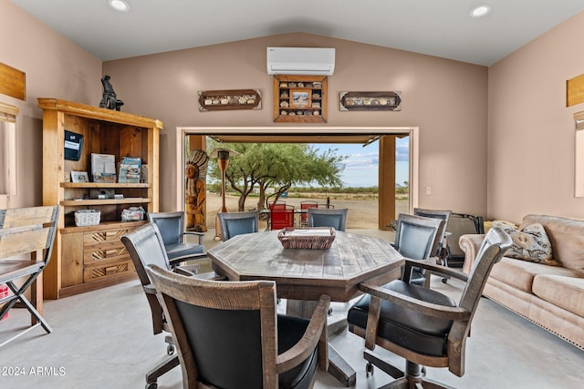 dining space featuring lofted ceiling and an AC wall unit