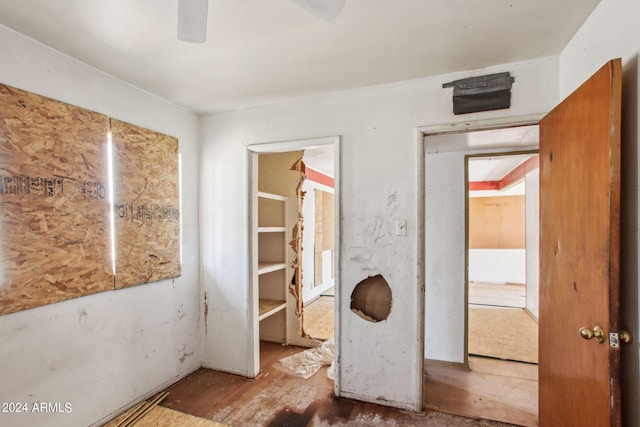 unfurnished bedroom featuring ceiling fan and wood-type flooring