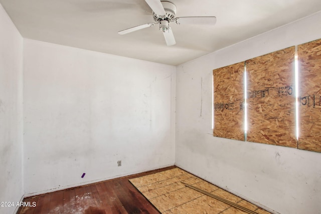 unfurnished room with ceiling fan and wood-type flooring