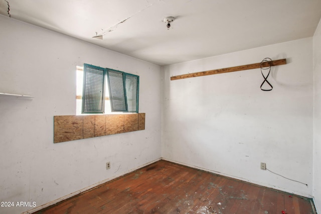 unfurnished room with hardwood / wood-style floors