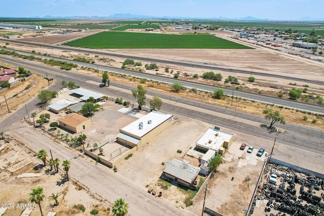 birds eye view of property with a rural view