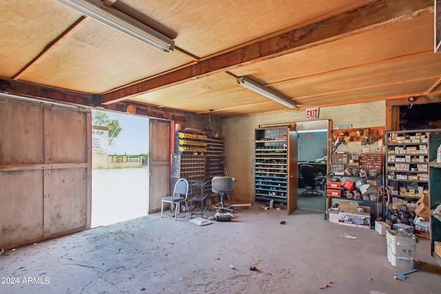 misc room featuring concrete floors and a workshop area