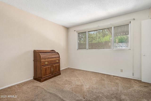 500 W Clarendon Ave Unit B11, Phoenix, AZ 85014 - carpeted spare room featuring a textured ceiling and baseboards