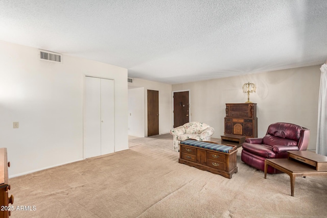 500 W Clarendon Ave Unit B11, Phoenix, AZ 85014 - living area with light colored carpet and a textured ceiling