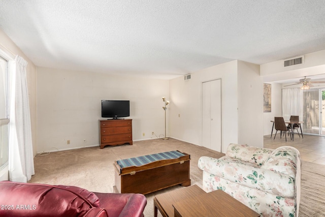 500 W Clarendon Ave Unit B11, Phoenix, AZ 85014 - carpeted living room with a textured ceiling and ceiling fan