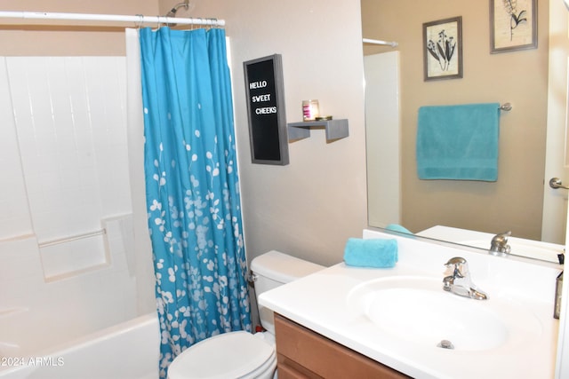 full bathroom with vanity, toilet, and shower / bath combo with shower curtain