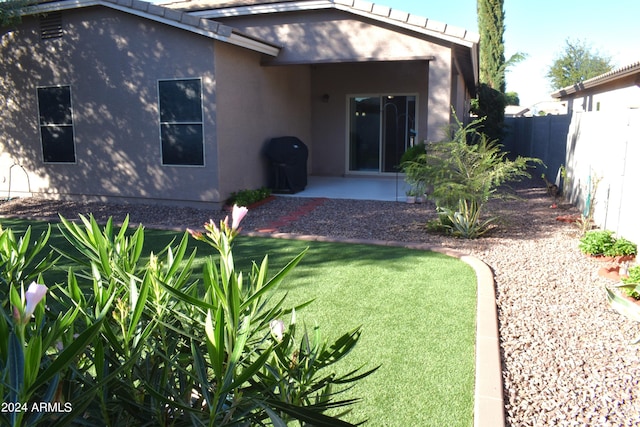 rear view of property featuring a patio