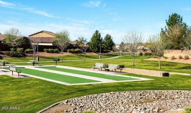 view of home's community featuring a lawn