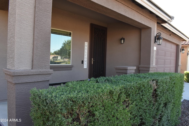 property entrance with a garage