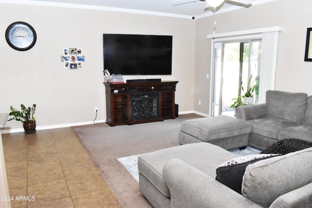 tiled living room featuring ceiling fan and crown molding