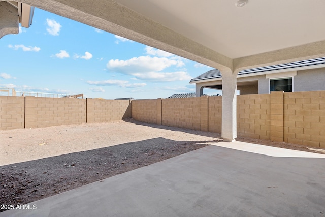 view of yard with a fenced backyard and a patio area