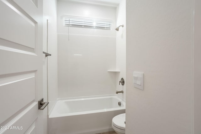 bathroom featuring  shower combination and toilet