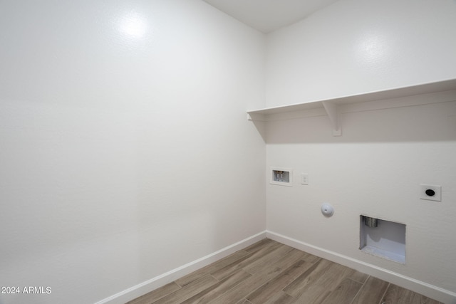 laundry room with hookup for an electric dryer, gas dryer hookup, wood-type flooring, and hookup for a washing machine