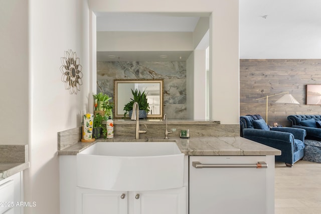 interior space featuring a sink and light wood finished floors