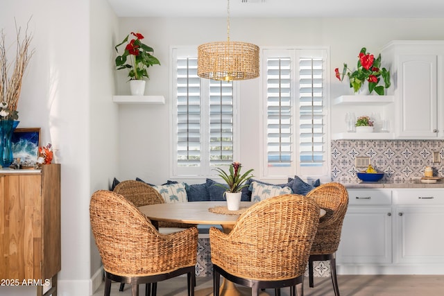 dining space featuring breakfast area and visible vents