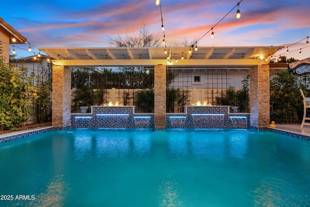 pool with fence and a pergola