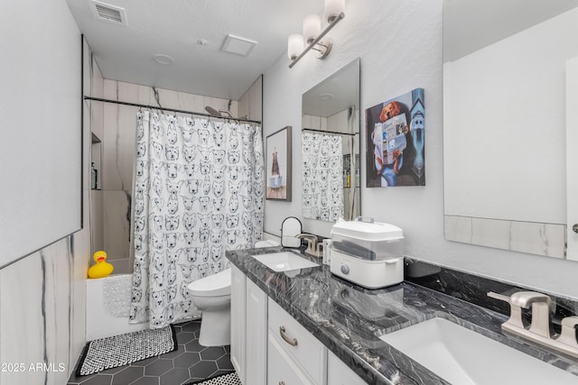 bathroom with shower / tub combo with curtain, visible vents, a sink, and toilet