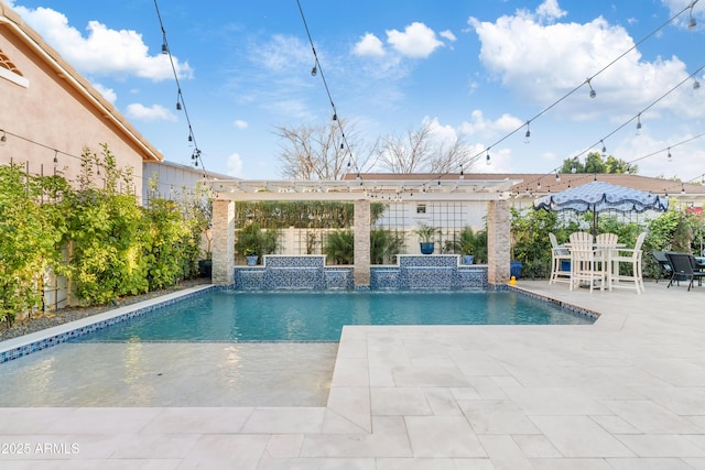 pool featuring a patio area and fence