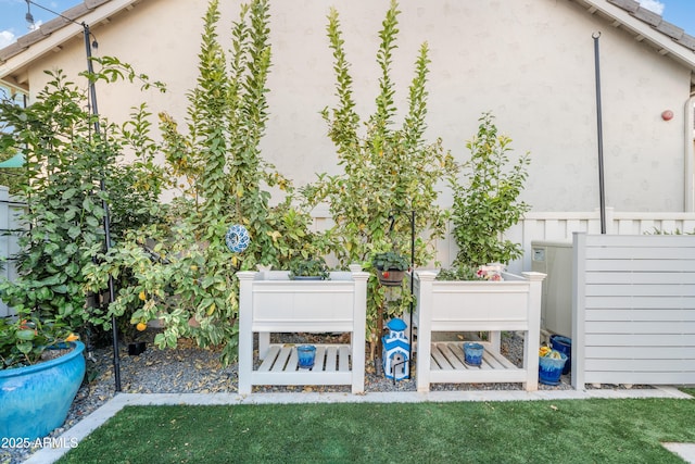 exterior space with a lawn and stucco siding