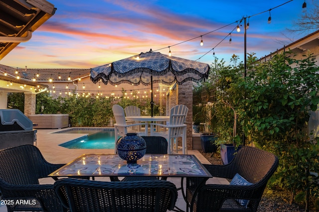 view of patio / terrace featuring outdoor dining space, a grill, and a fenced in pool