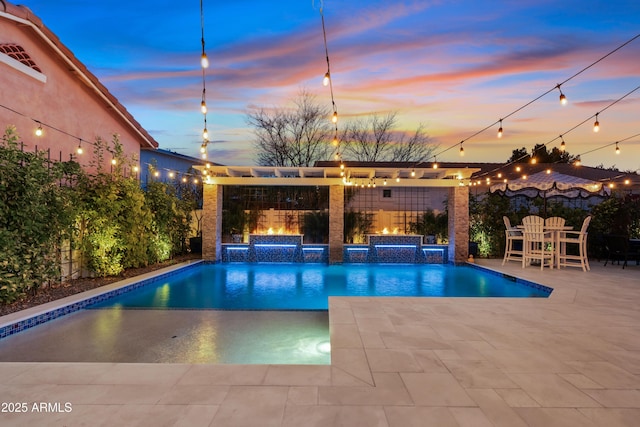 view of pool featuring a pool with connected hot tub and a patio