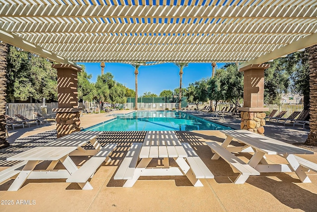 pool with a pergola, fence, and a patio