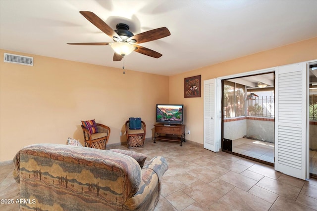 bedroom featuring access to outside, a ceiling fan, and visible vents