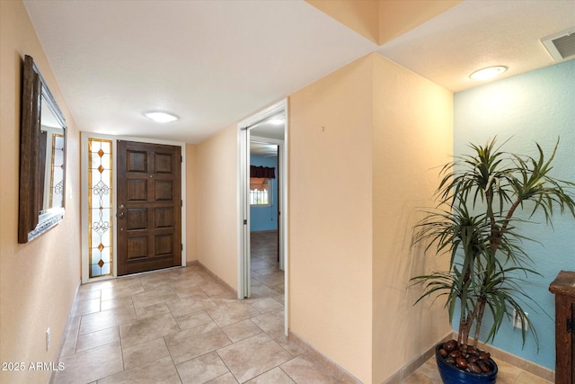 entryway with visible vents and baseboards
