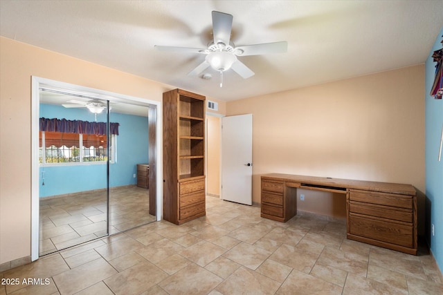 unfurnished office with visible vents and a ceiling fan