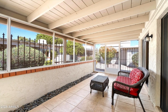 sunroom / solarium with beamed ceiling