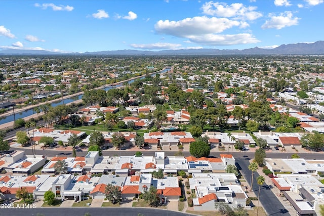 birds eye view of property featuring a mountain view and a residential view