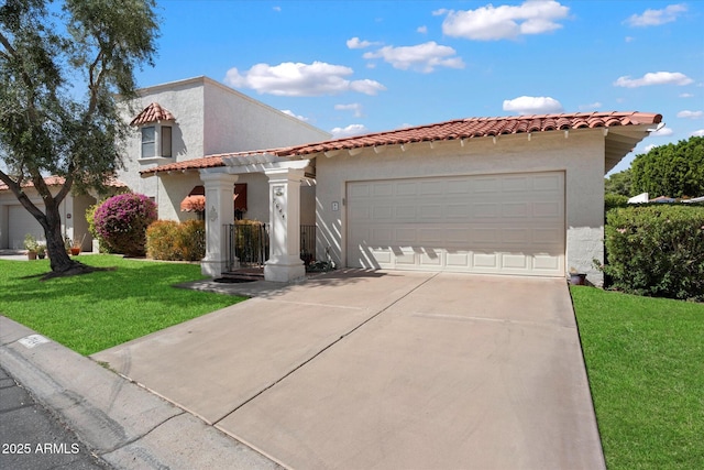 mediterranean / spanish home featuring a front yard, a garage, concrete driveway, a tile roof, and stucco siding