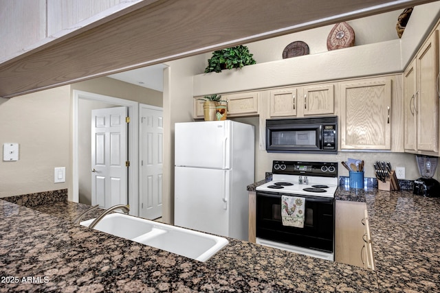 16357 E Arrow Dr Unit 115, Fountain Hills, AZ 85268 - kitchen featuring electric range oven, freestanding refrigerator, black microwave, and a sink