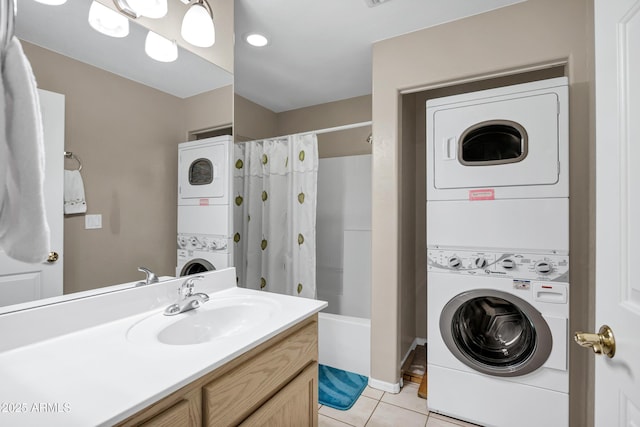 16357 E Arrow Dr Unit 115, Fountain Hills, AZ 85268 - bathroom with stacked washing machine and dryer, tile patterned flooring, vanity, and shower / bath combo with shower curtain