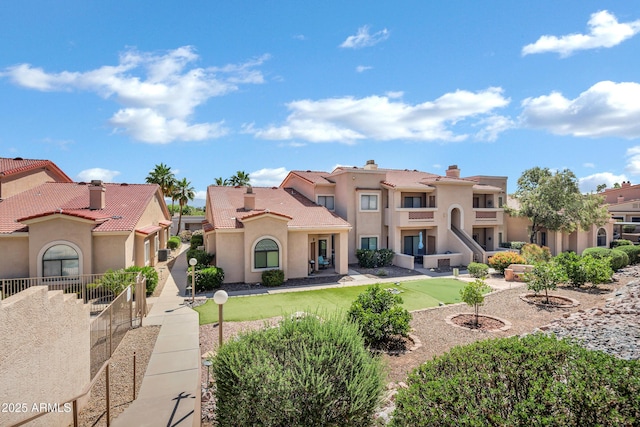 16357 E Arrow Dr Unit 115, Fountain Hills, AZ 85268 - mediterranean / spanish-style home with stucco siding, a putting green, and a residential view