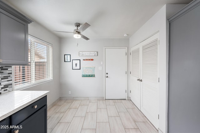 interior space with a ceiling fan