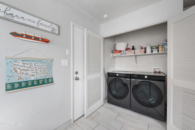 washroom featuring laundry area and washing machine and dryer