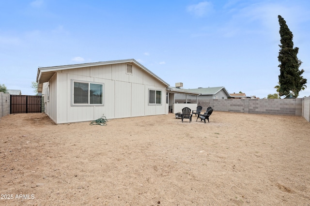 back of property featuring a fenced backyard