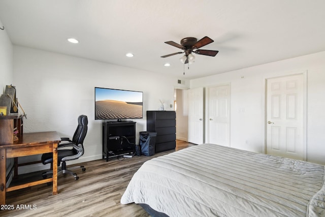 bedroom with recessed lighting, visible vents, a ceiling fan, wood finished floors, and baseboards