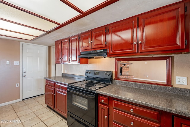 kitchen featuring light tile patterned floors and electric range