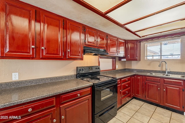 kitchen featuring sink, light tile patterned floors, and black electric range