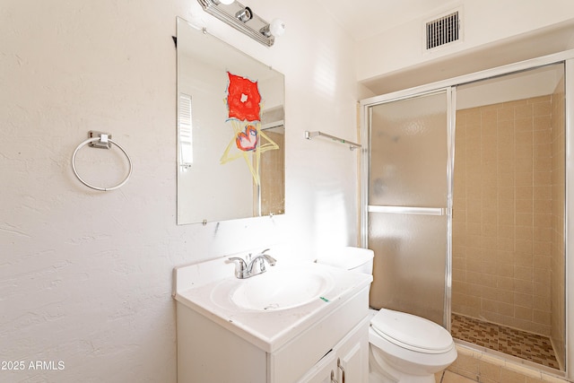 bathroom featuring walk in shower, vanity, and toilet