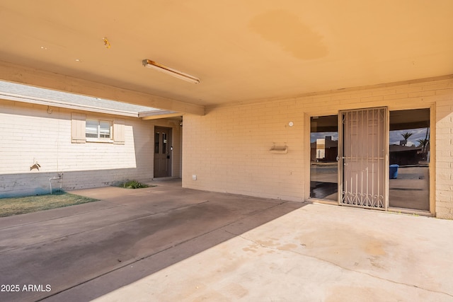 doorway to property featuring a patio area