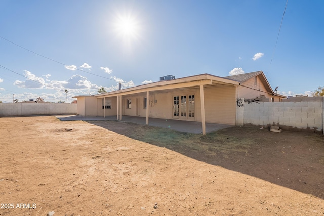 back of house featuring a patio and central air condition unit